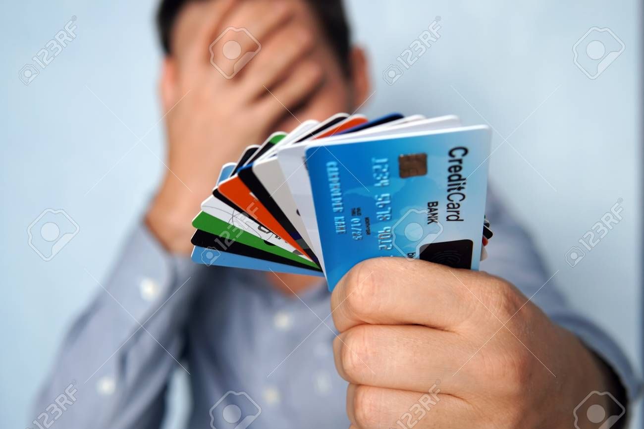 man confused credit cards